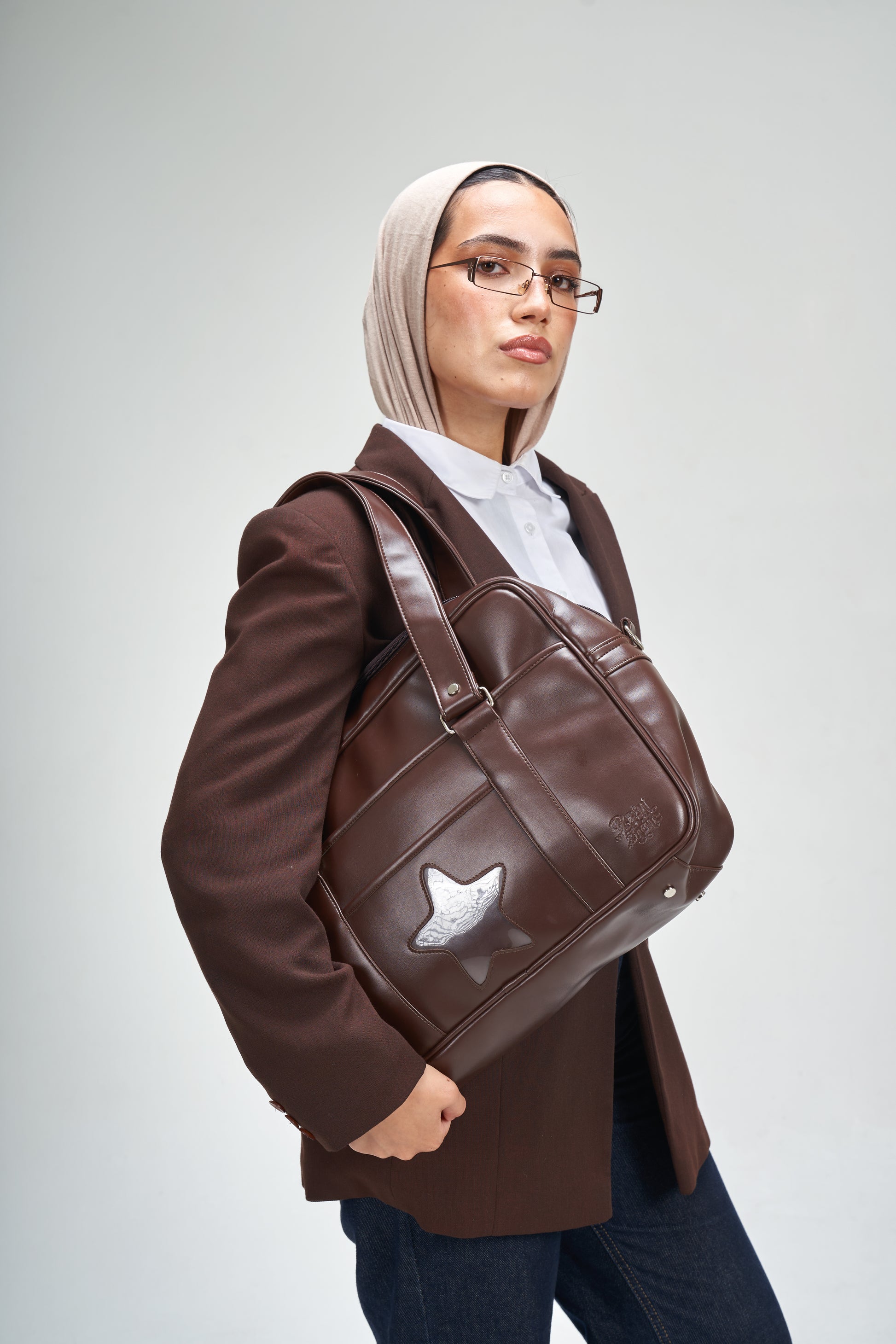 chocolate rain tote bag Naghedi Like a ripple of sculpted neoprene caught mid Chocolate Japanese Star Bag